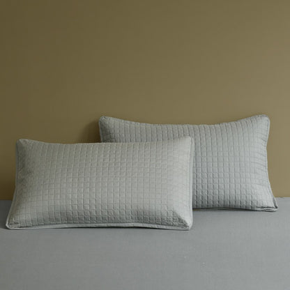 An ergonomic memory foam cervical traction pillow